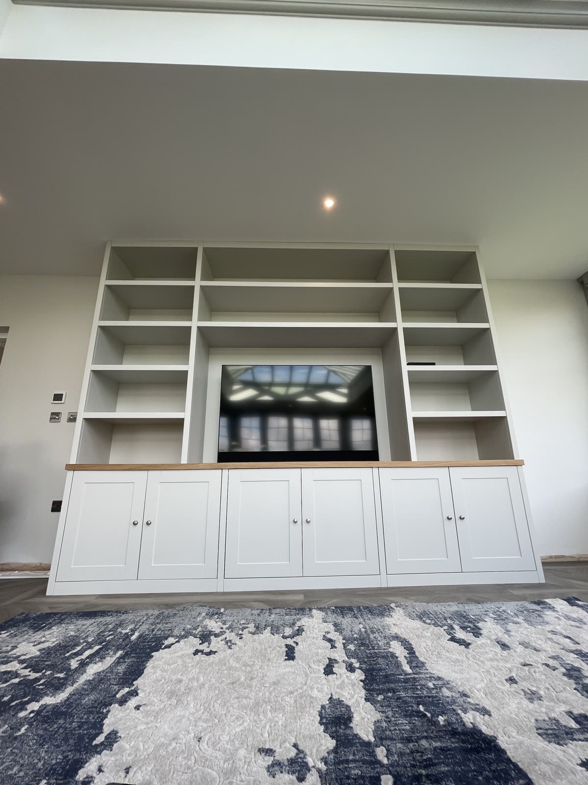 Custom media wall with TV and integrated storage