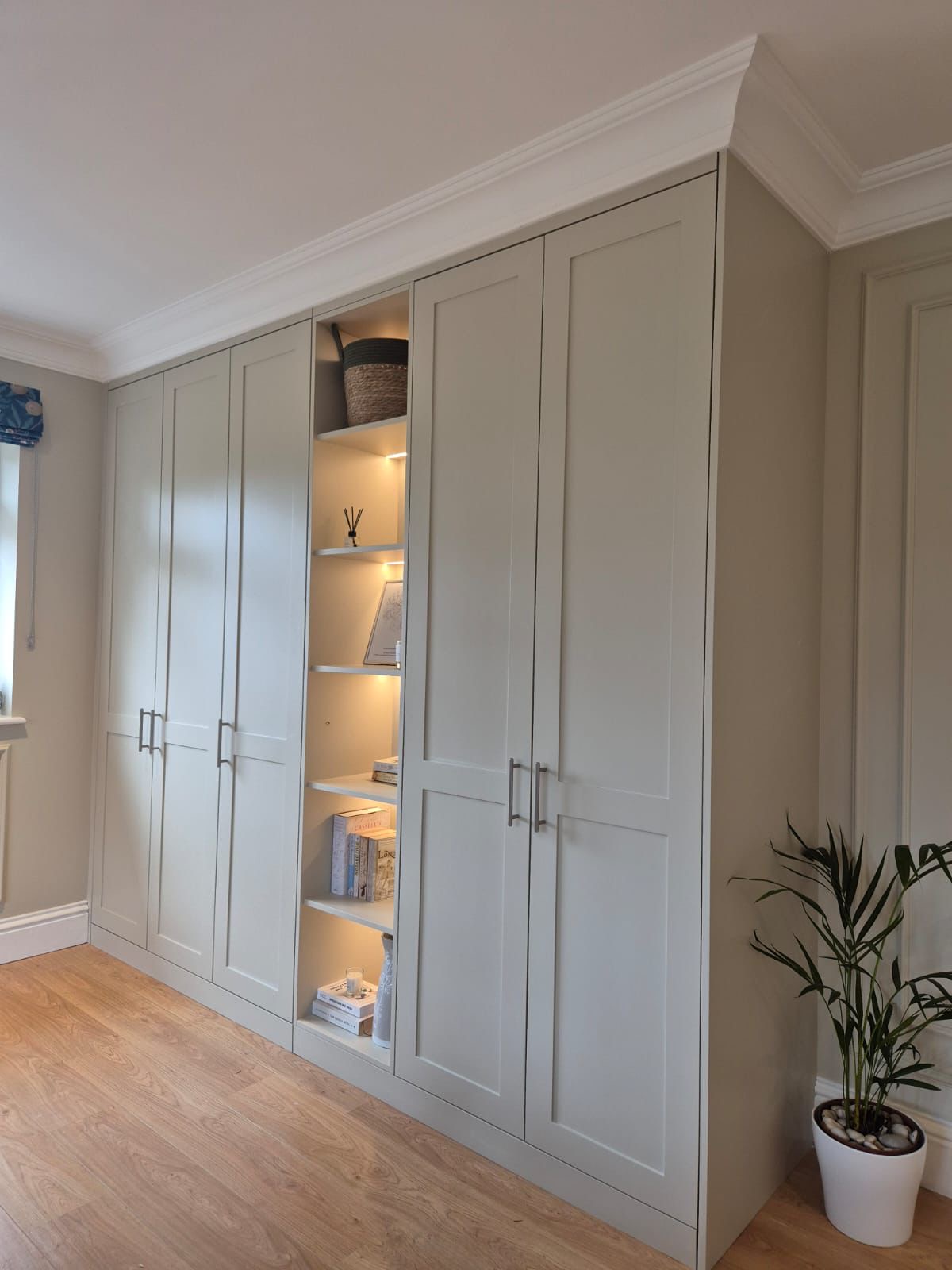 Bespoke fitted wardrobe with lit shelving